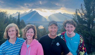 Matt with his family in the mountains